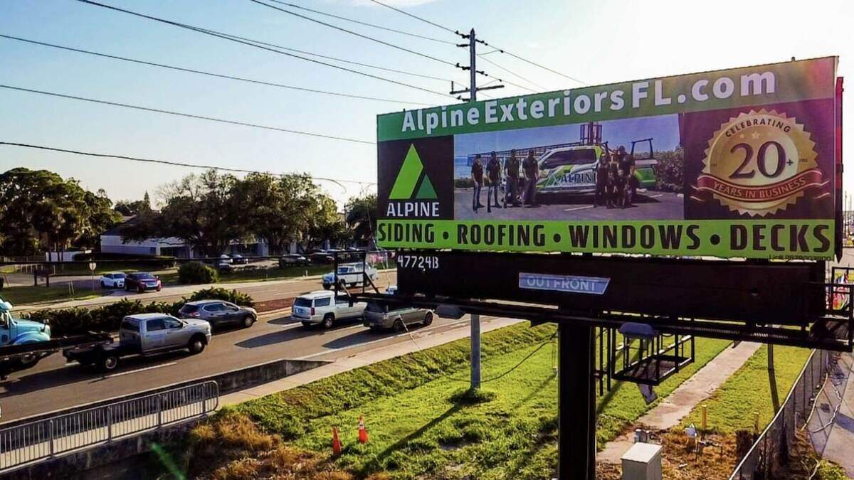 Alpine Exteriors Florida Billboard - Serving Tampa Bay Area with Premium Siding, Roofing, Windows & Decks featuring 20 years celebration and AlpineExteriorsFL.com